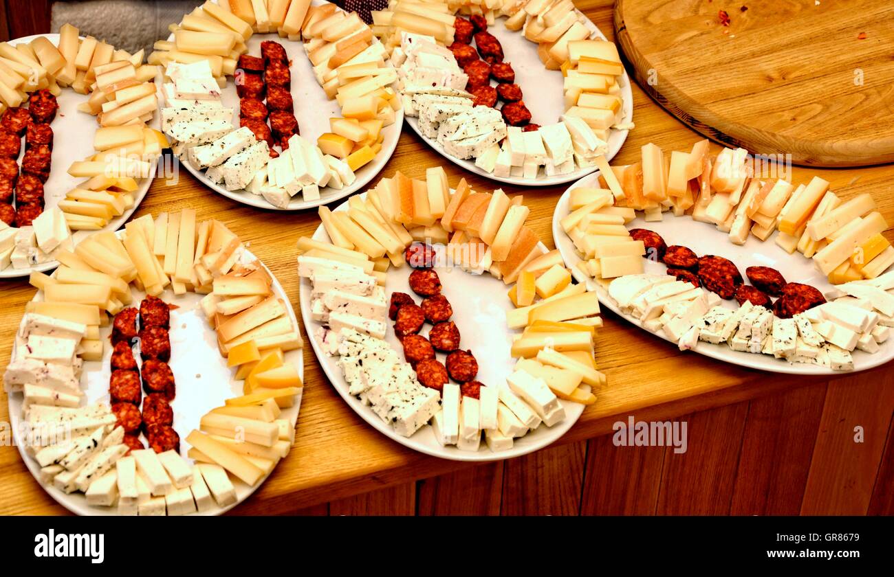 Assorted Cheeses Garnished Plates With Kolbasz Stock Photo