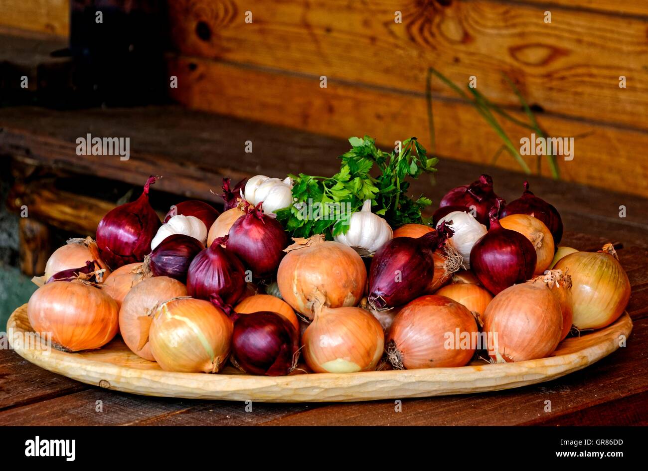 Onion, Allium Cepa, Varieties On Wooden Plate Stock Photo