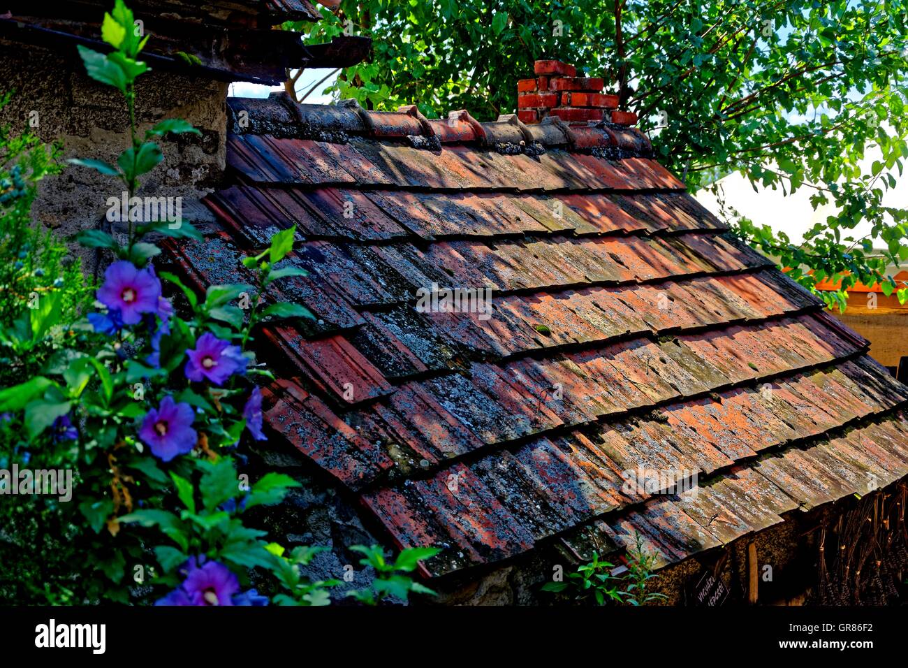 Old Brick House Roof Stock Photo