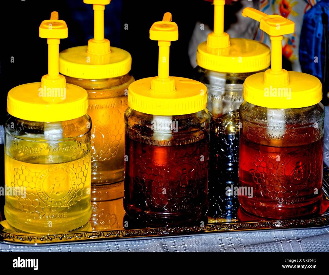 Yellow Honey Dispenser Glasses Stock Photo