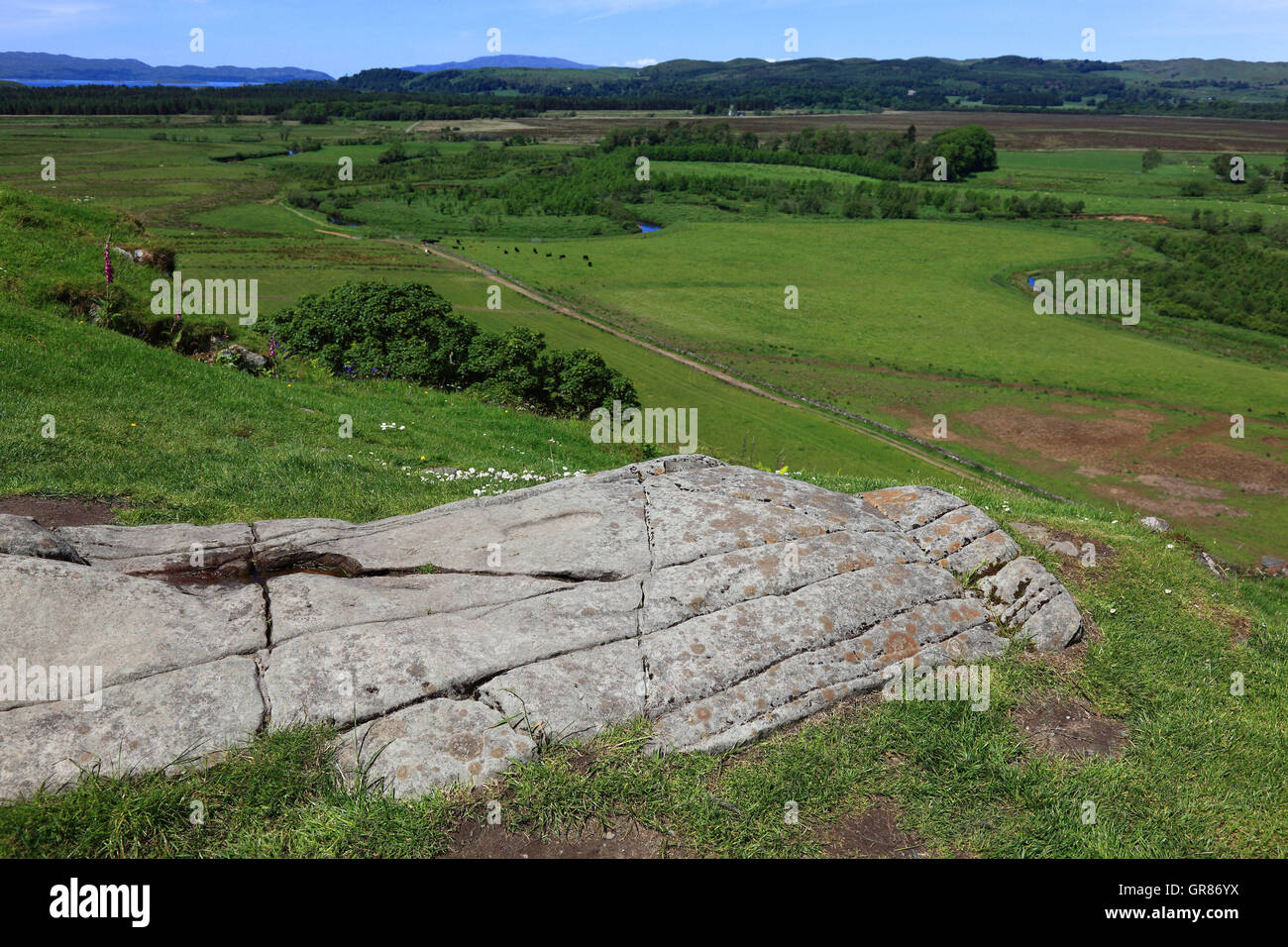 Scotland, Kilmartin Glen, rests of former fort Dun, Dunadd or also Hillfort, rock record on the hill of the fort Stock Photo