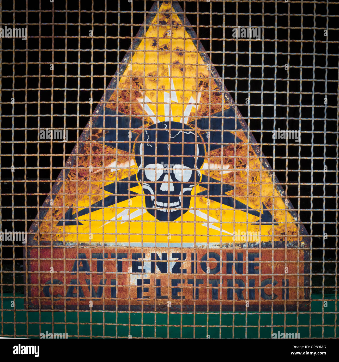 Rusted sign of danger of death Stock Photo
