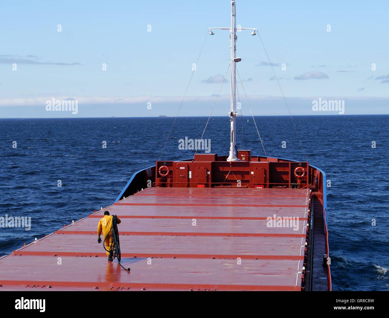 Freighter In Calm Sea Stock Photo