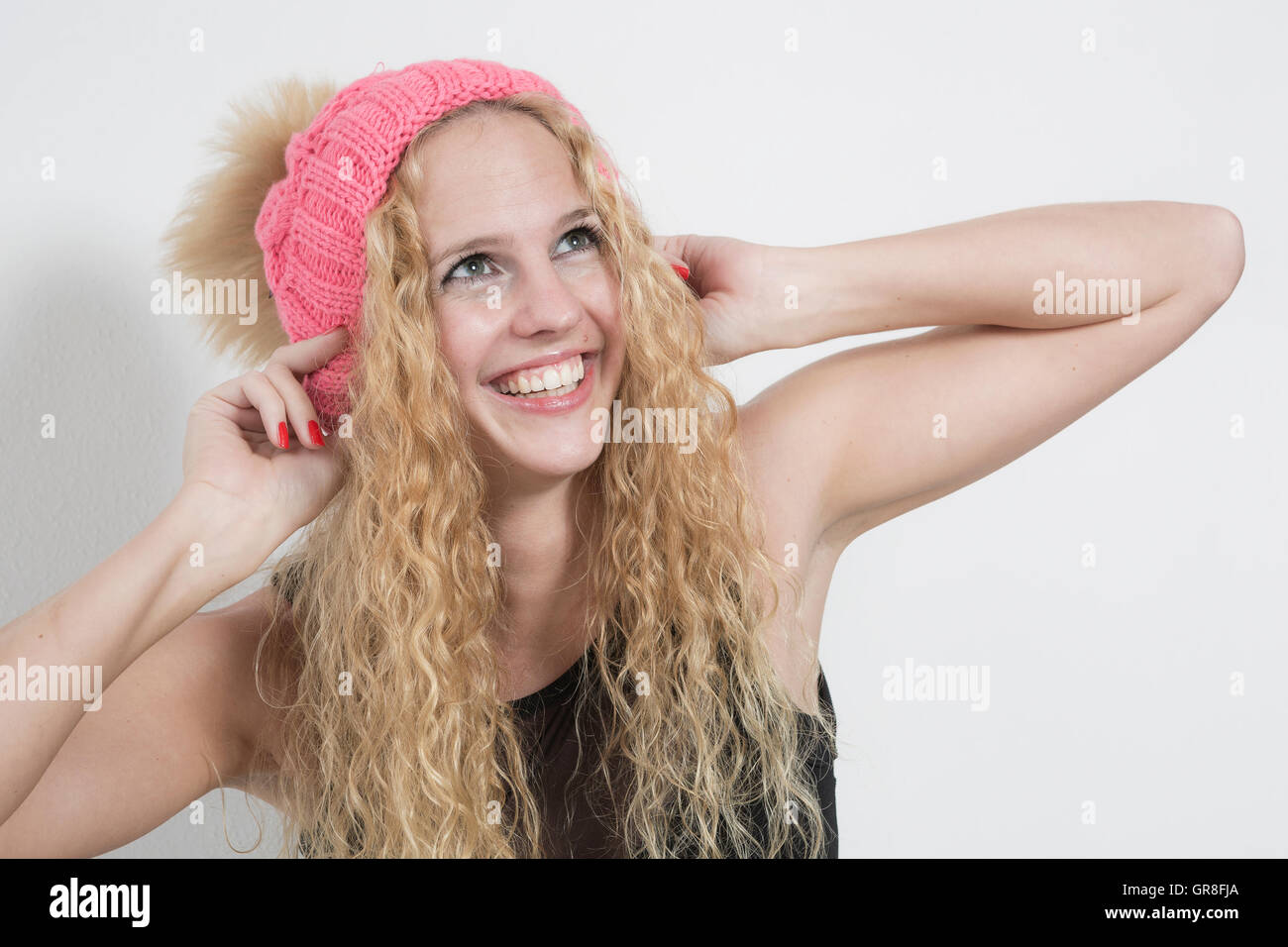 Portrait Shot Of A Young Woman With Long Blond Hair Stock Photo