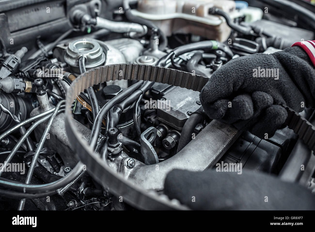Replacing the belt. Car repair. Under the hood of the car. Toned photo
