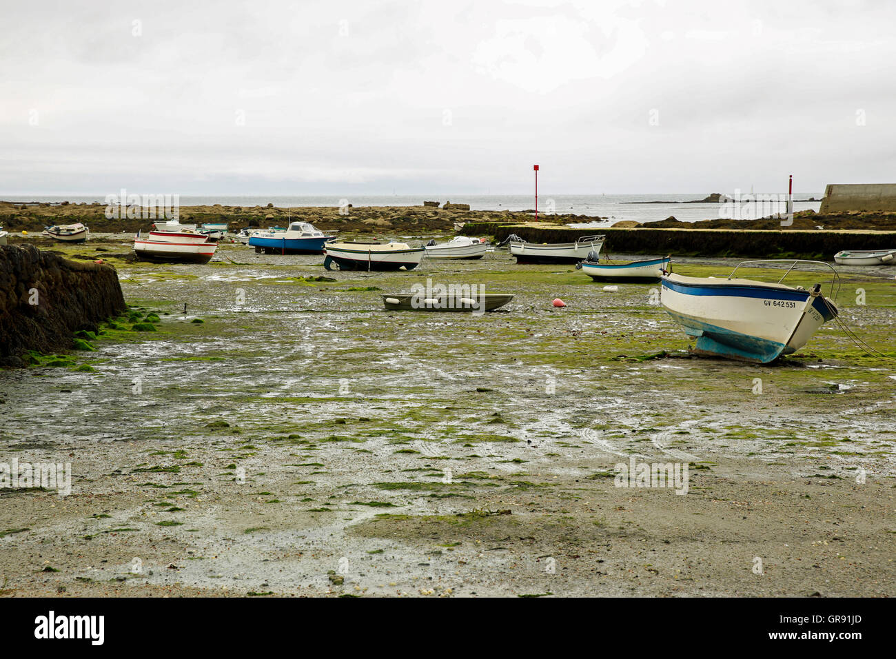 Boats At Low Tide In The Bay Of Saint Pierre, Finistere, Brittany Stock Photo