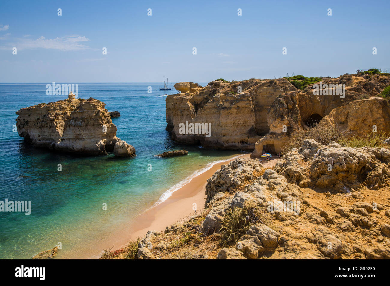 Rocky Coast On The Algarve In Sunshine With Blue Sky, Portugal, Europe ...