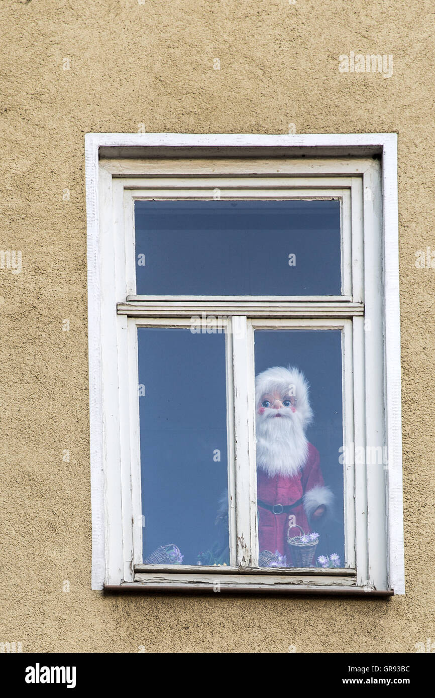 Santa Claus Figurine Standing Behind A Window Pane Stock Photo