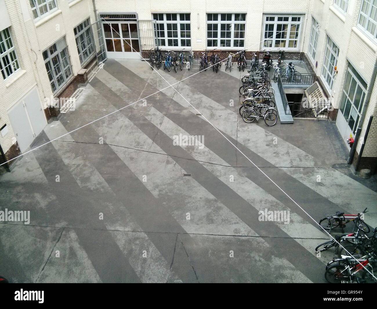 High Angle View Of Bicycles Parked In Front Of Building Stock Photo