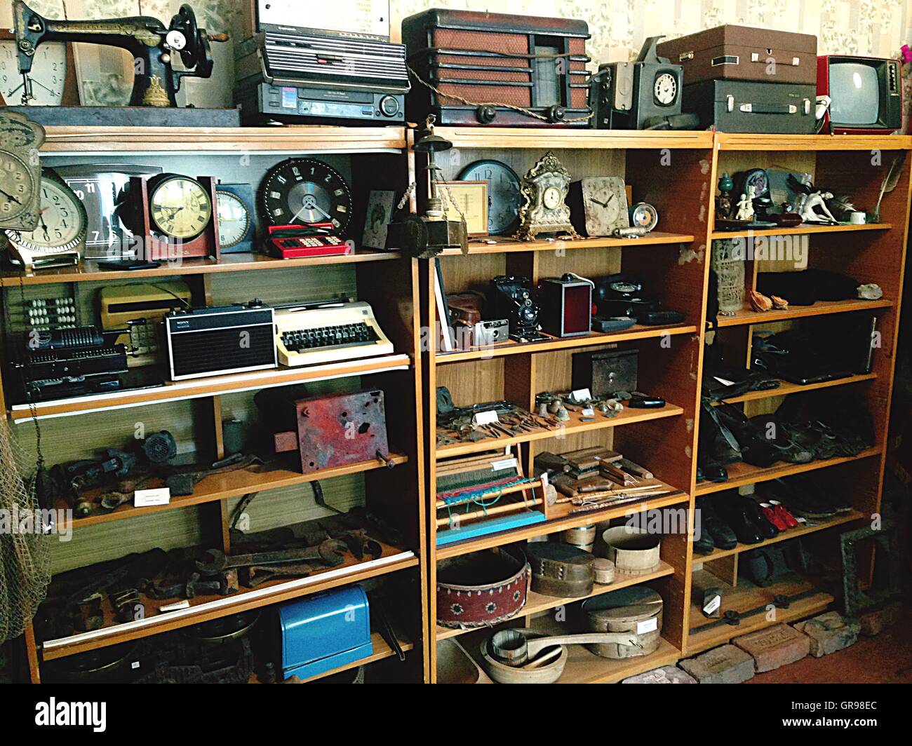 Old Fashioned Objects On Bookshelf In Museum Stock Photo