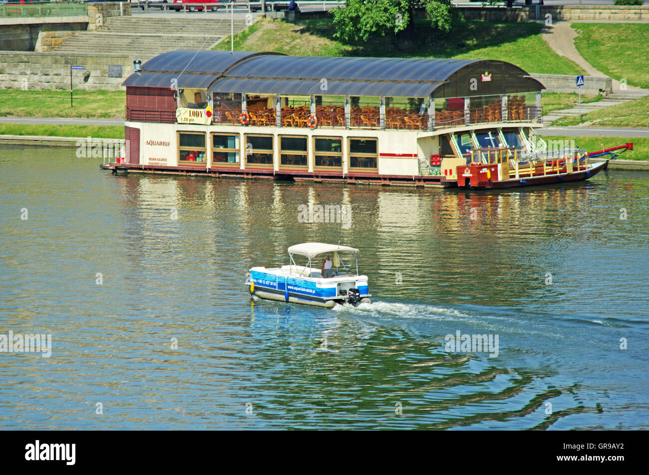 Cafe and Pleasure Boat on the River Wista, Cracow/Krakcow, Poland Stock Photo