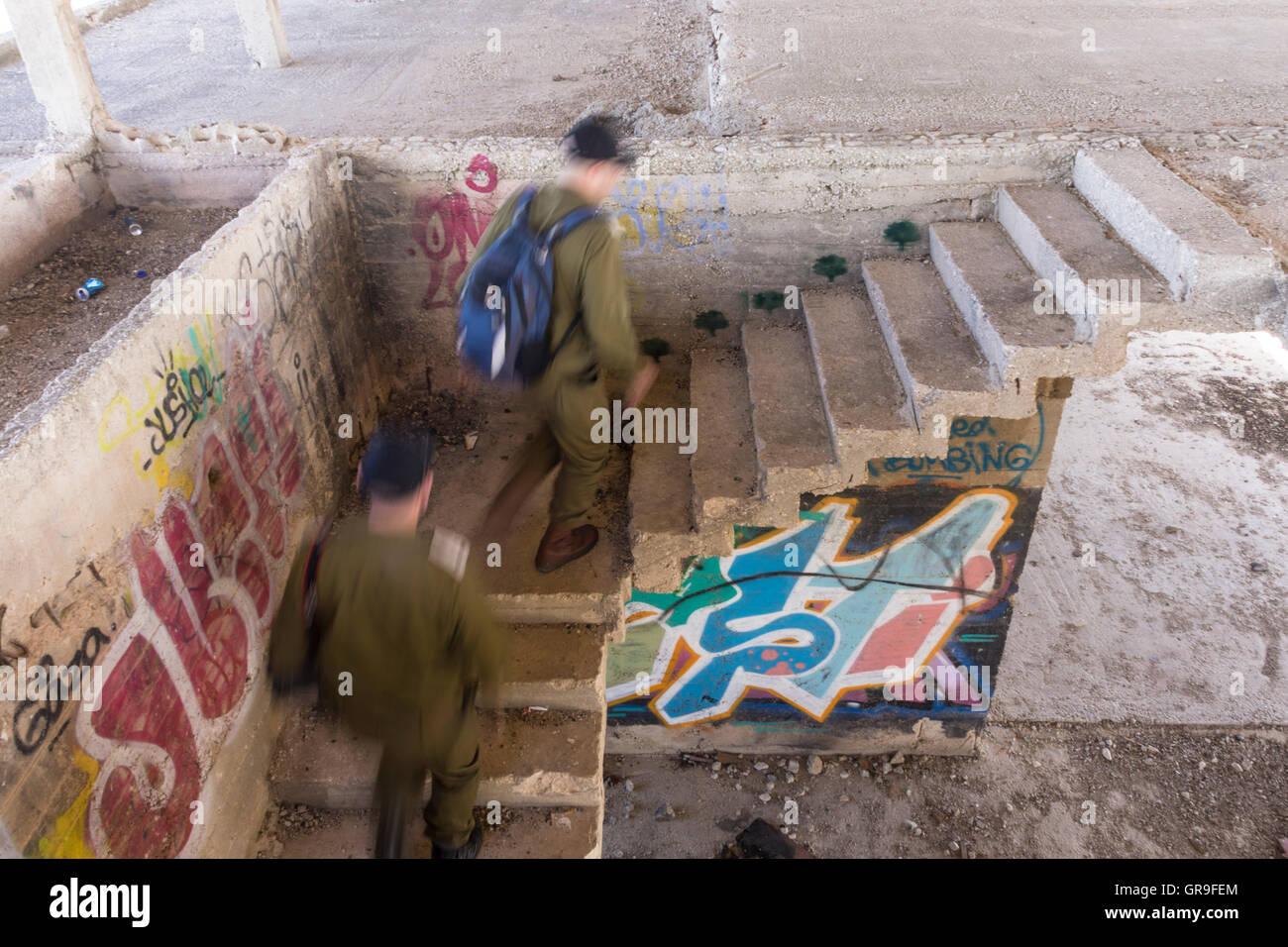 Jerusalem, Israel. Army officers go up the staircase in Jordanian king Hussein's never-completed summer resort at Tel-el-Ful Stock Photo