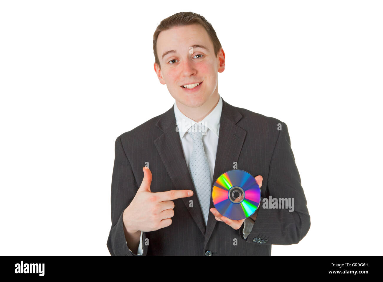 Businessman with memory disk over white background Stock Photo