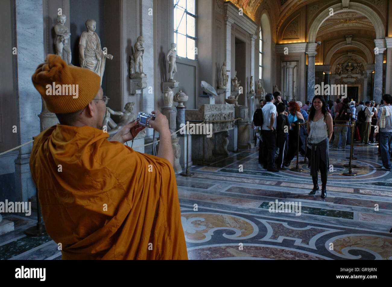 Asian tourists in the Vatican Museum in Vatican City a city-state that is surrounded by Rome Italy Stock Photo