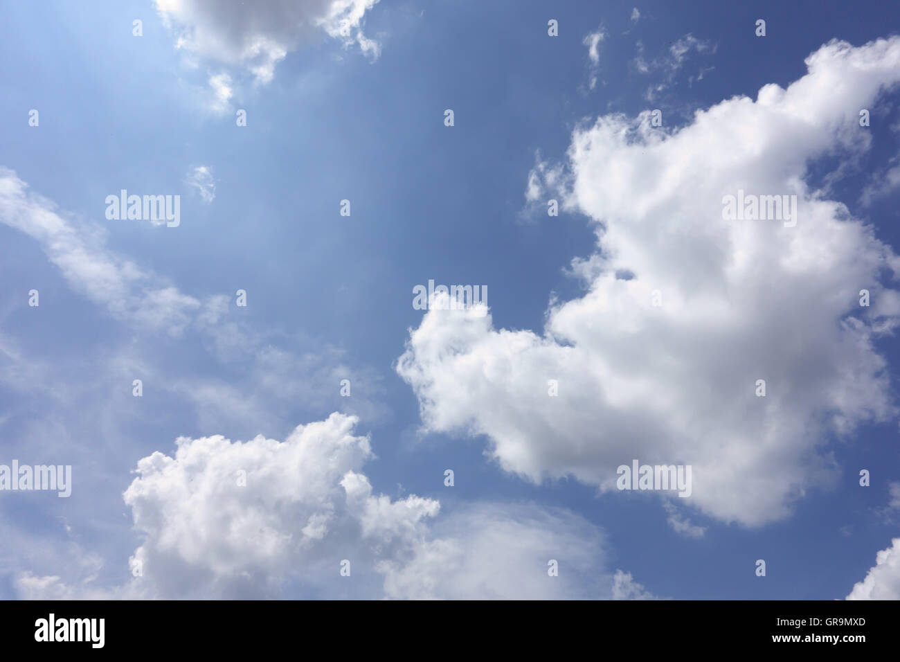 white clouds floating on a background of blue sky Stock Photo - Alamy