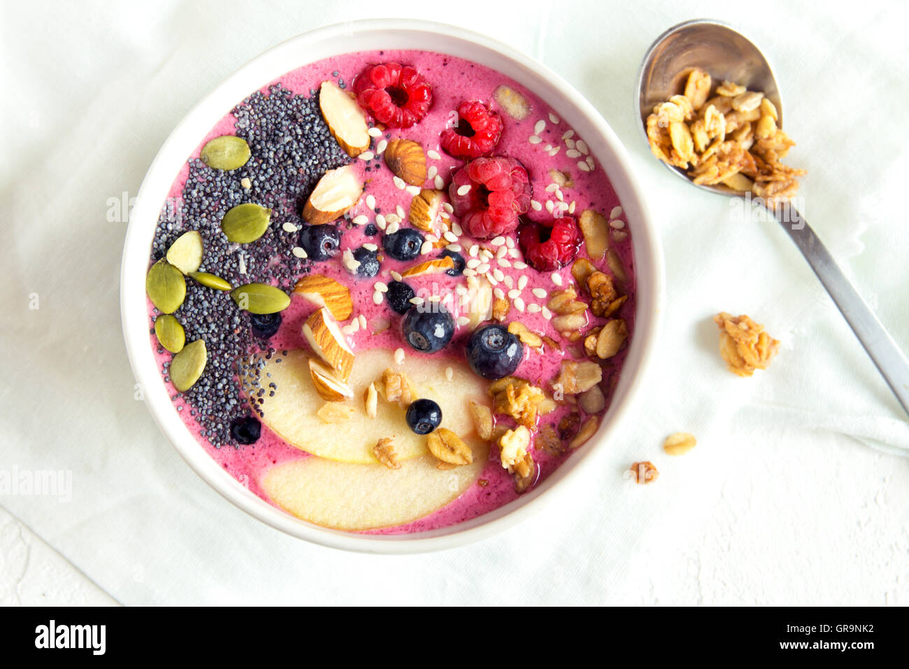 Smoothie bowl with fresh berries, nuts, seeds and homemade granola for healthy breakfast Stock Photo