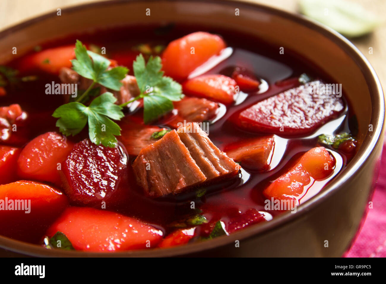 Vegetables and meat red beetroot soup (borsch) in bowl close up ...