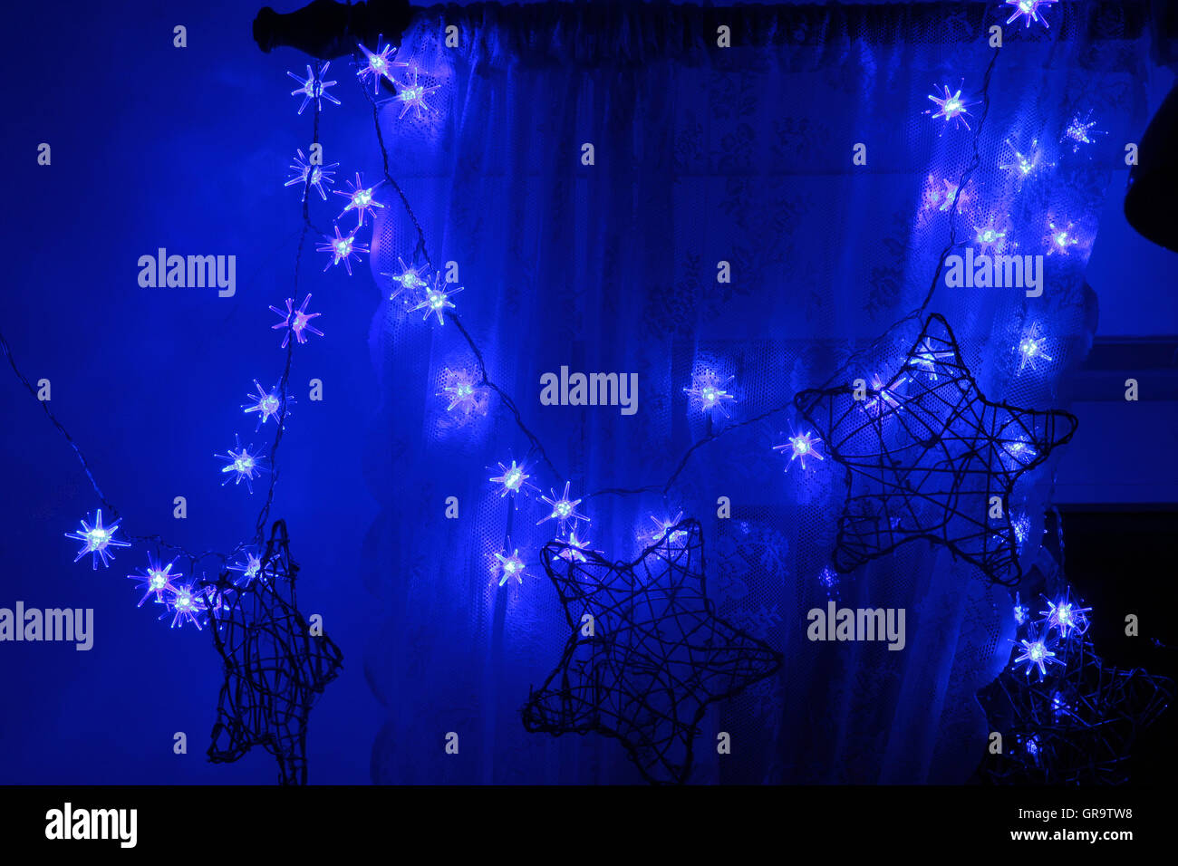 Blue Christmas Lights In Windows Stock Photo Alamy