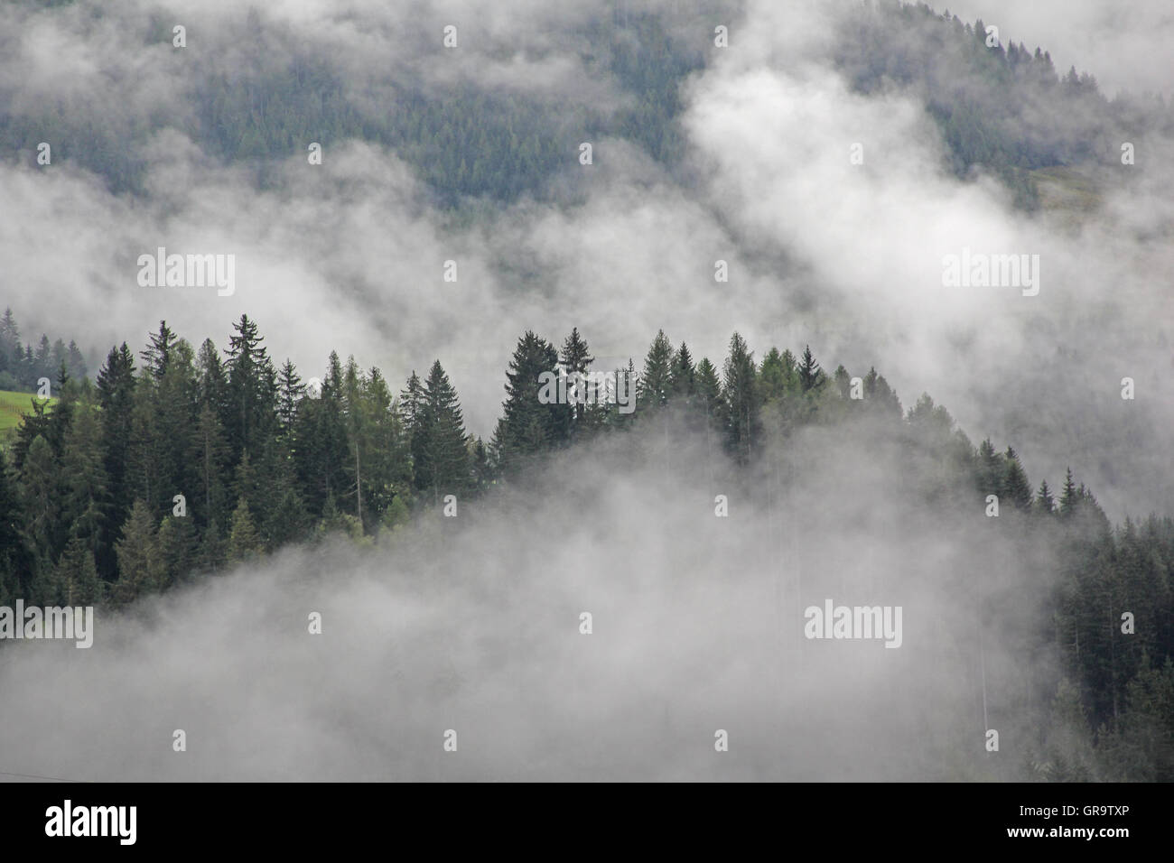 Cloud In September Over The Mountain Forest In Carinthia, Austria Stock Photo