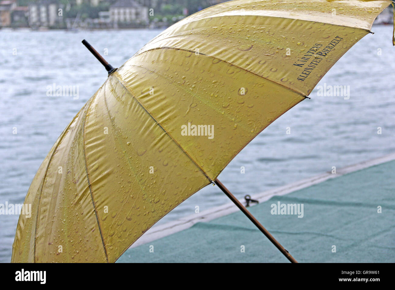 Yellow Umbrella Am Wörthersee Stock Photo