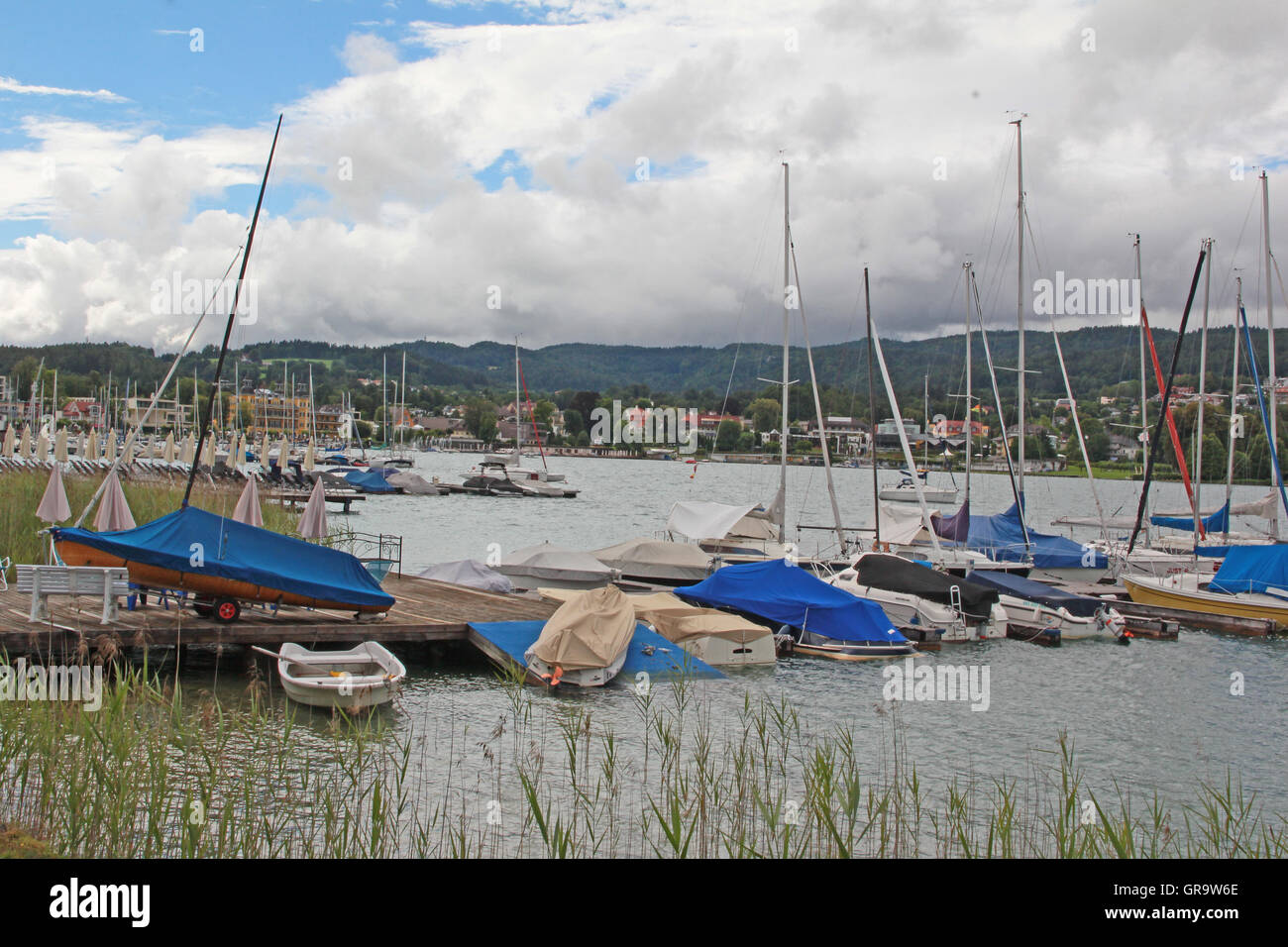 Boats In The Bay Of Velden Am Wörthersee In Carinthia Stock Photo