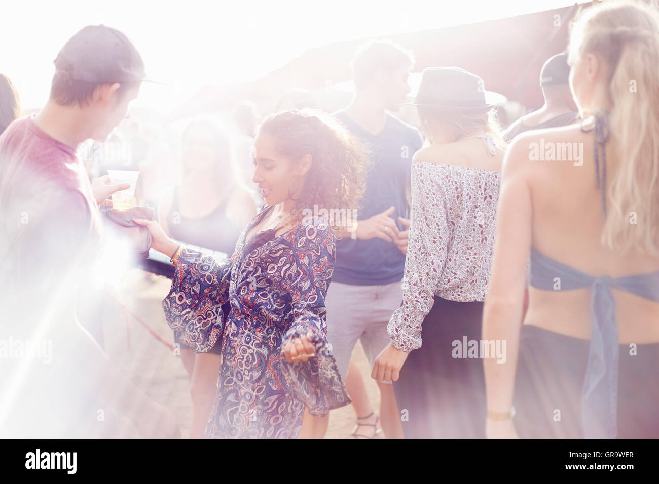 Young woman dancing at music festival Stock Photo - Alamy