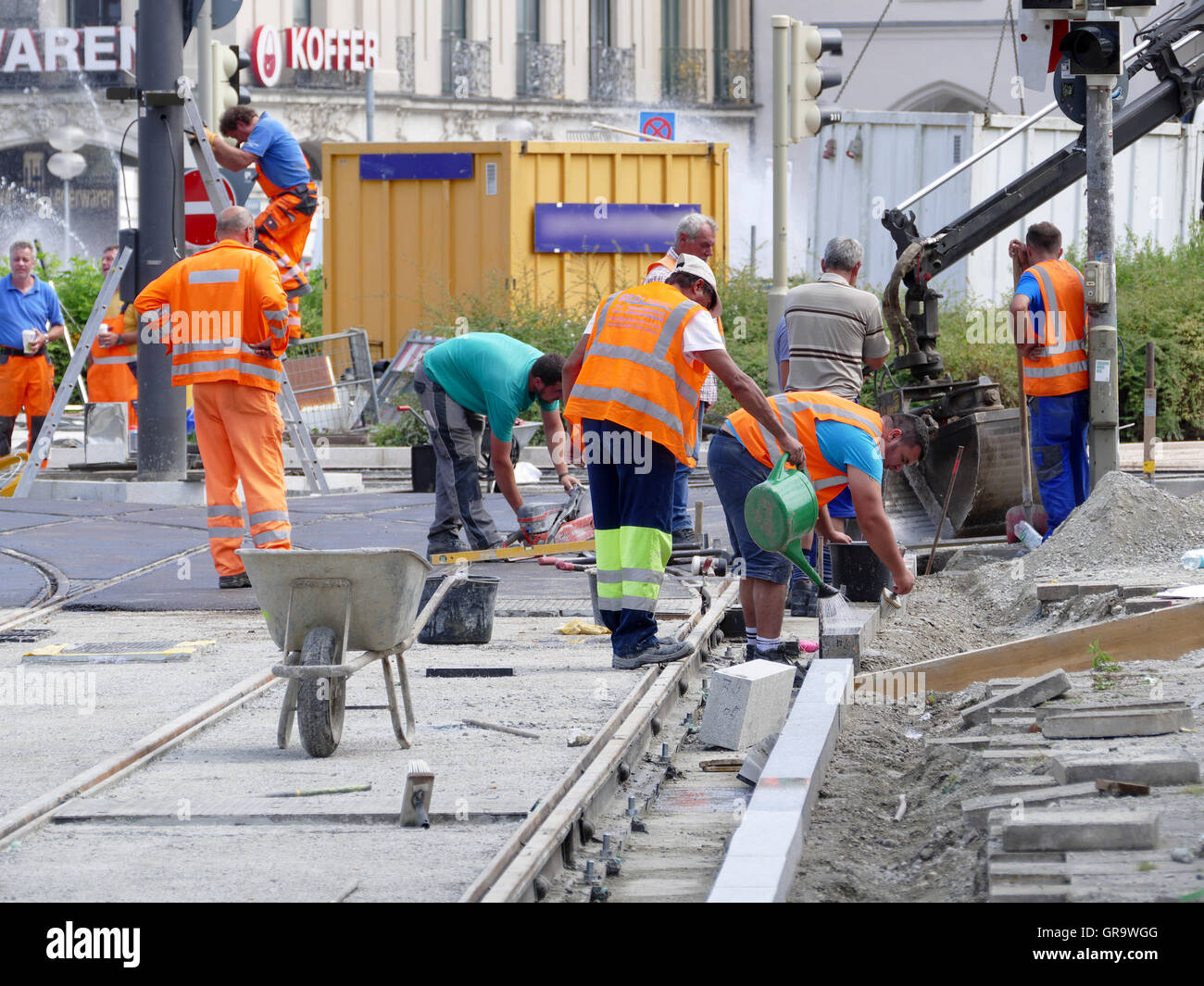 Construction worker building new Tram way Munich Germany Europe Stock
