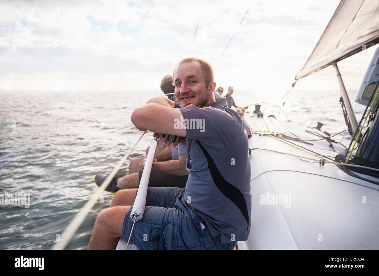 Portrait smiling man sailing on sailboat Stock Photo