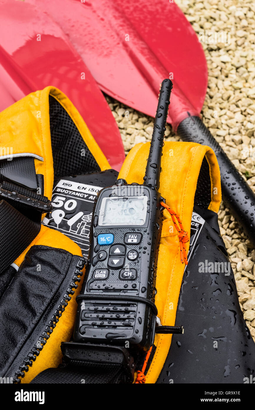 Kayak paddle, buoyancy aid and VHF radio Stock Photo Alamy