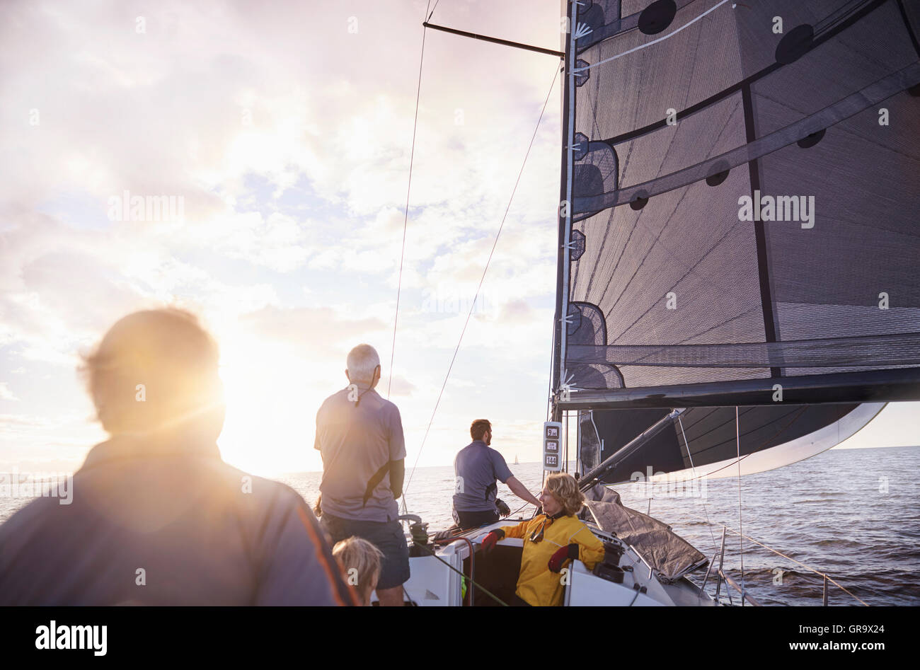 Friends sailing on sunny ocean Stock Photo