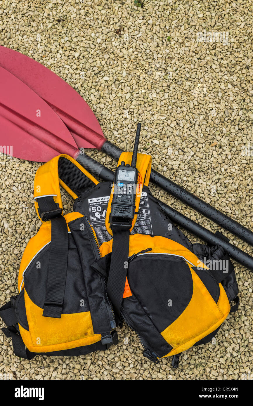 Kayak paddle, buoyancy aid and VHF radio Stock Photo Alamy