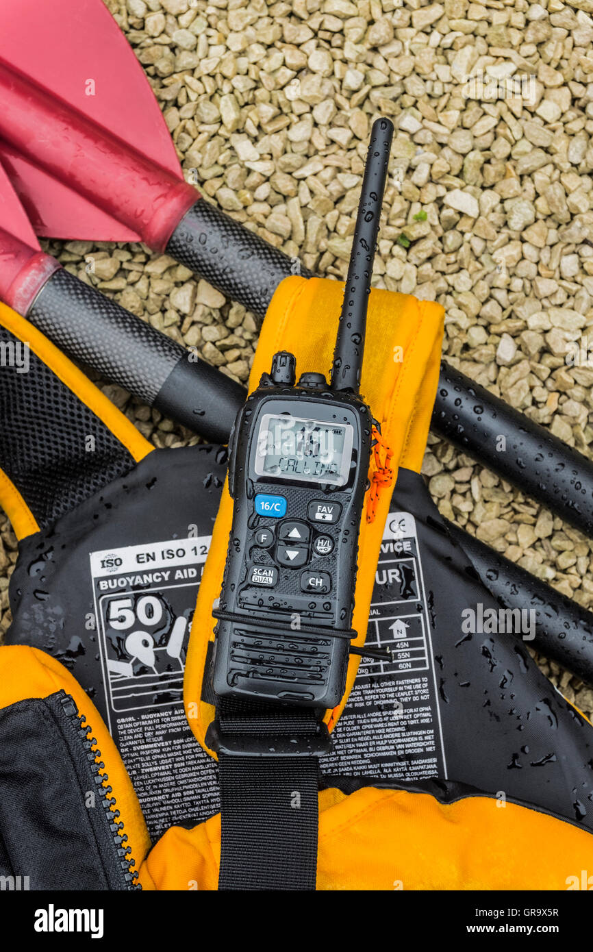 Kayak paddle, buoyancy aid and VHF radio Stock Photo Alamy