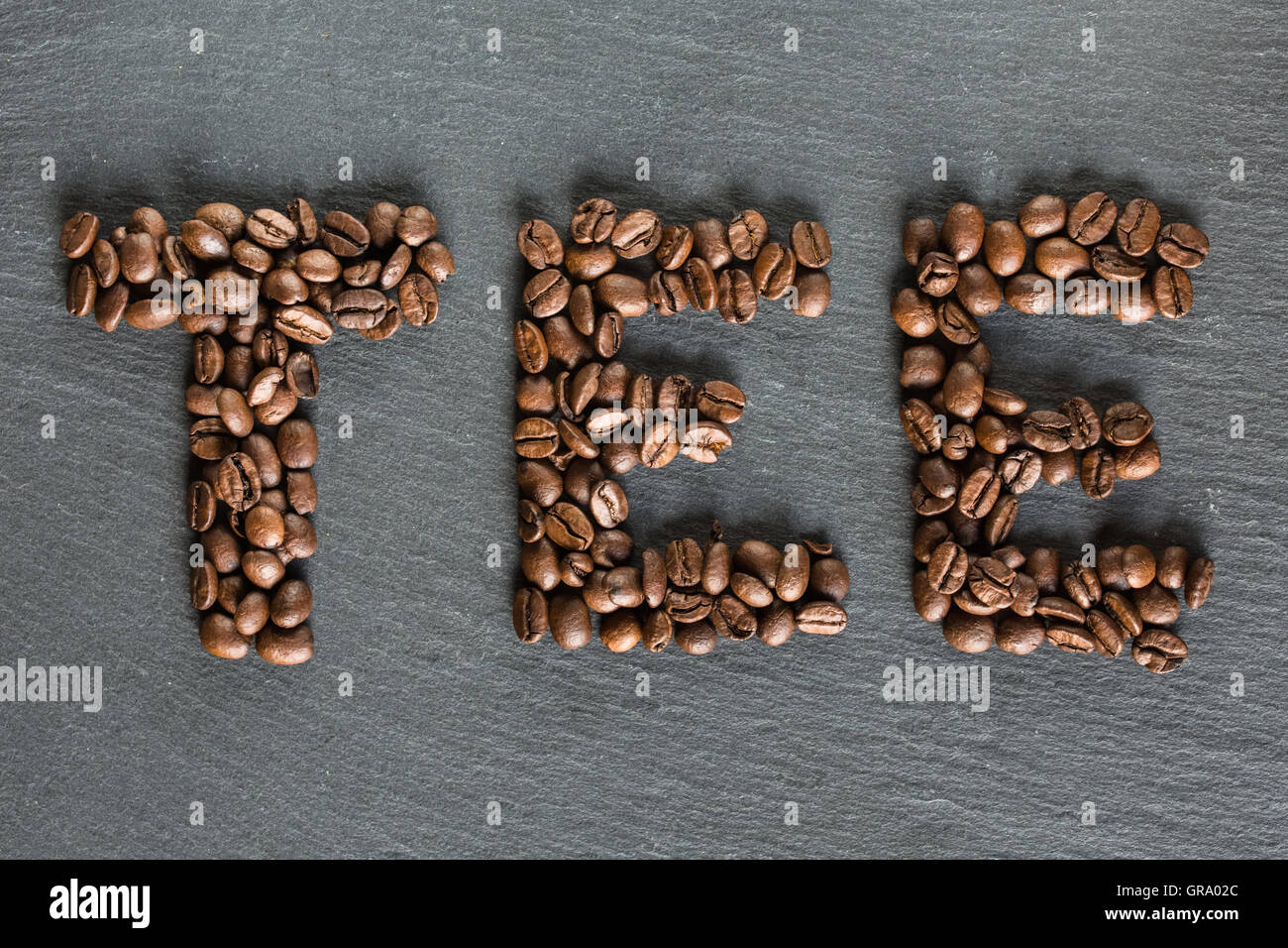 The Word Tea Written From Coffee Beans Stock Photo Alamy