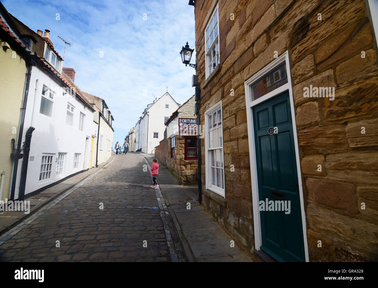 A steep cobbled street in Whitby, north Yorkshire, UK Stock Photo