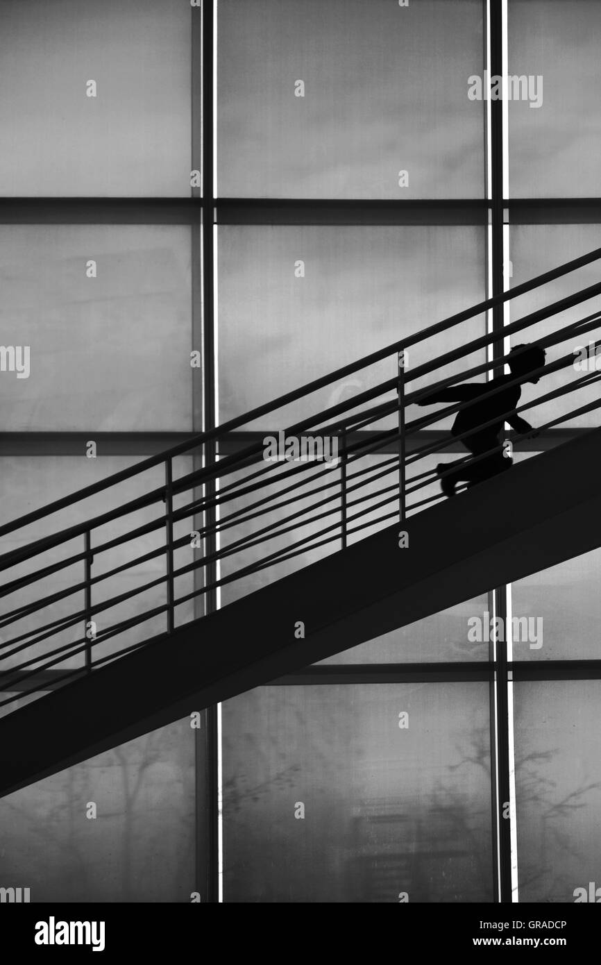 Boy Silhouette Climbing Stairs Stock Photo