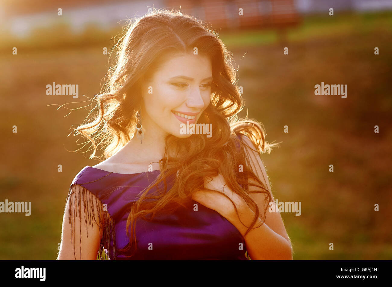 beautiful young woman posing in the park Stock Photo - Alamy