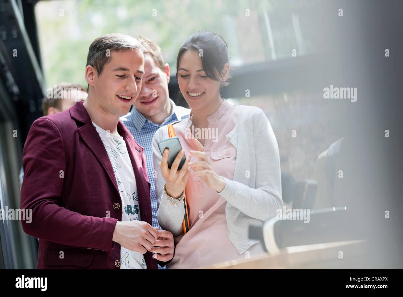 Business people using smart phone at technology conference Stock Photo ...