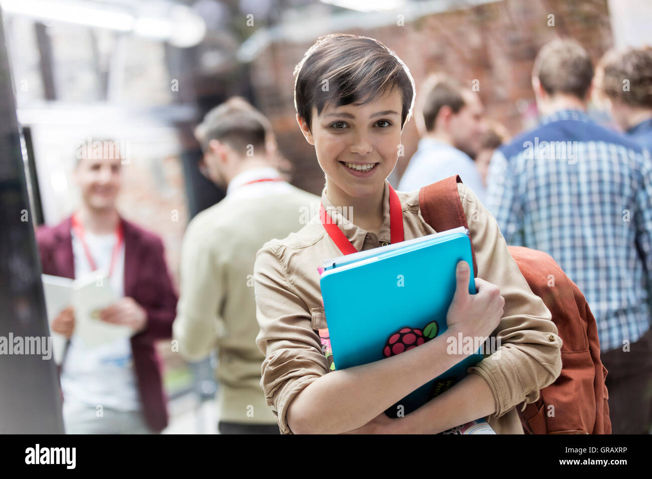 Portrait smiling female college student with backpack and laptop Stock ...