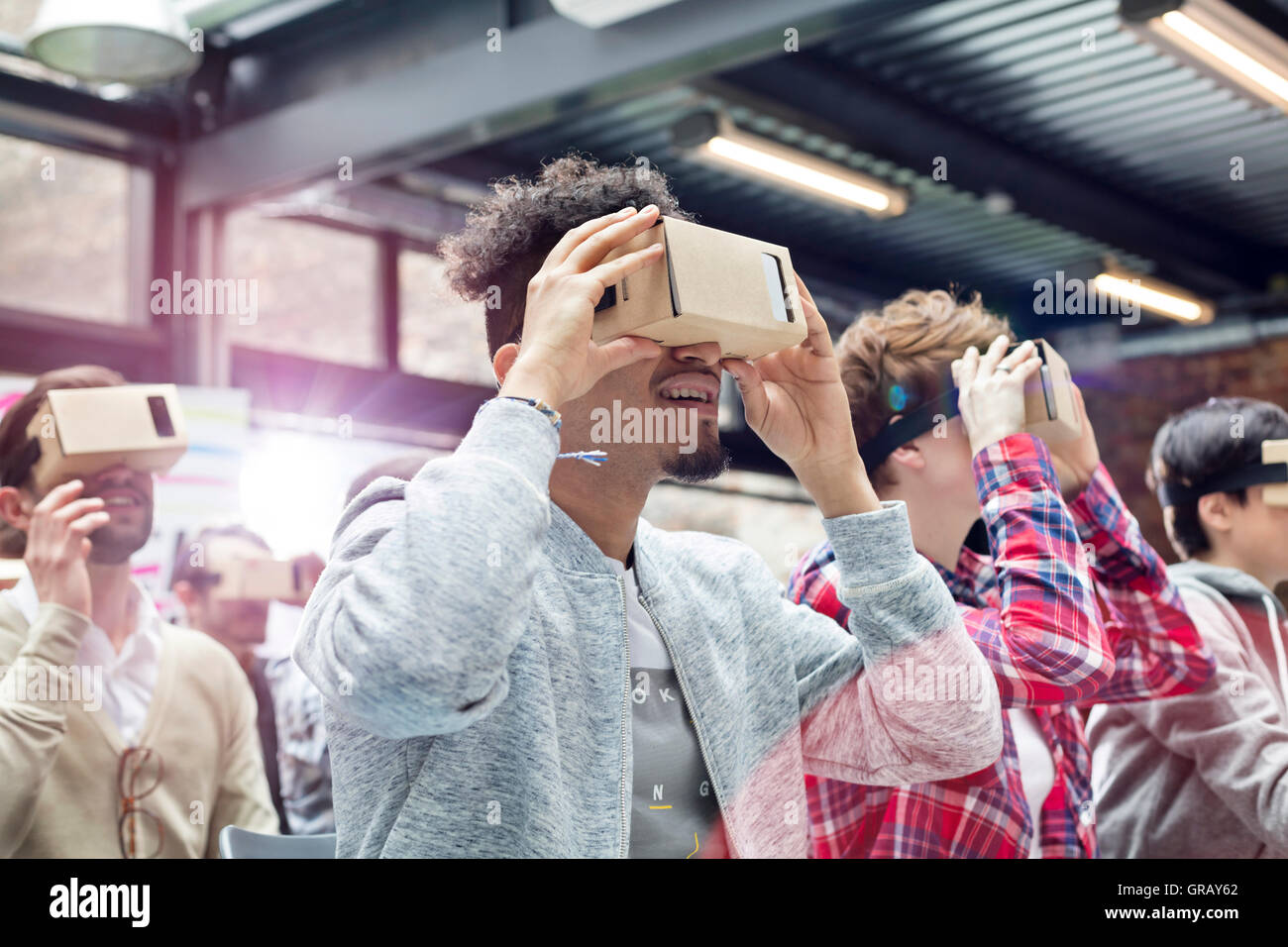 Audience trying virtual reality simulator glasses at technology ...
