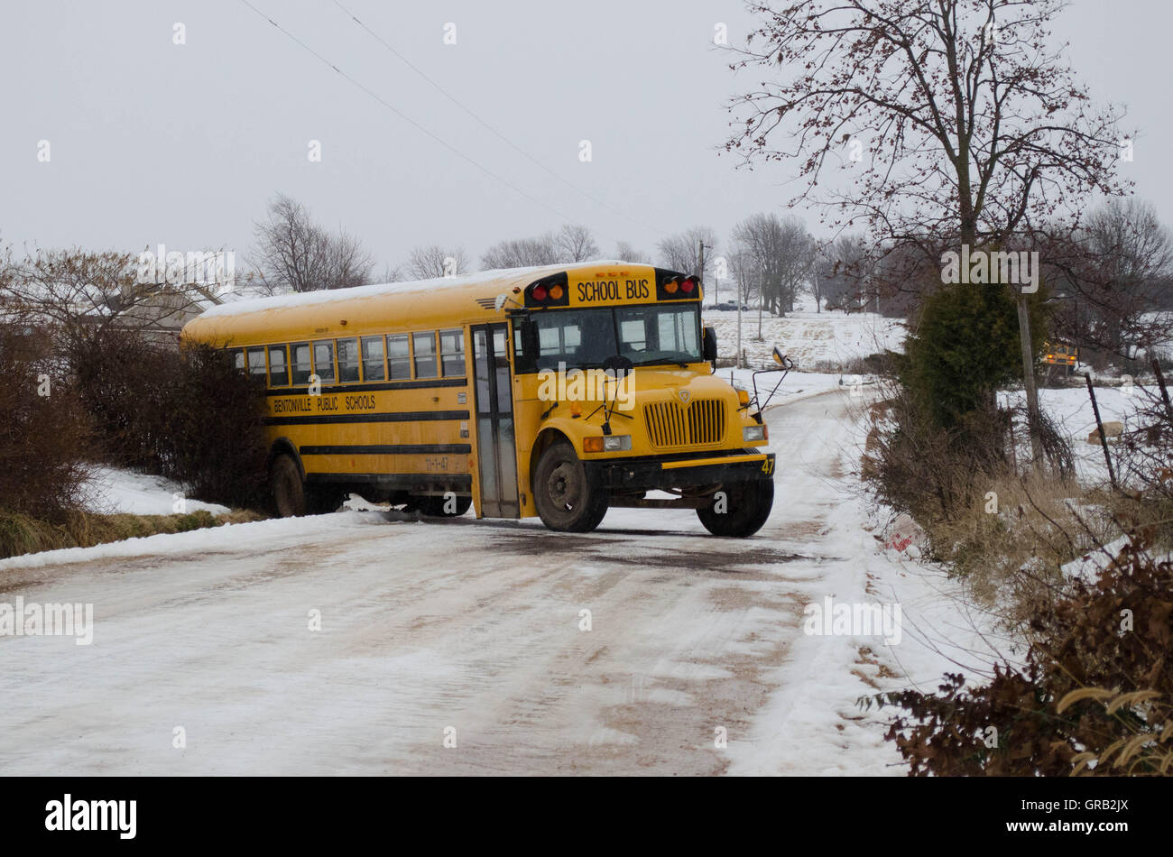 School bus slides off the slick road Stock Photo Alamy