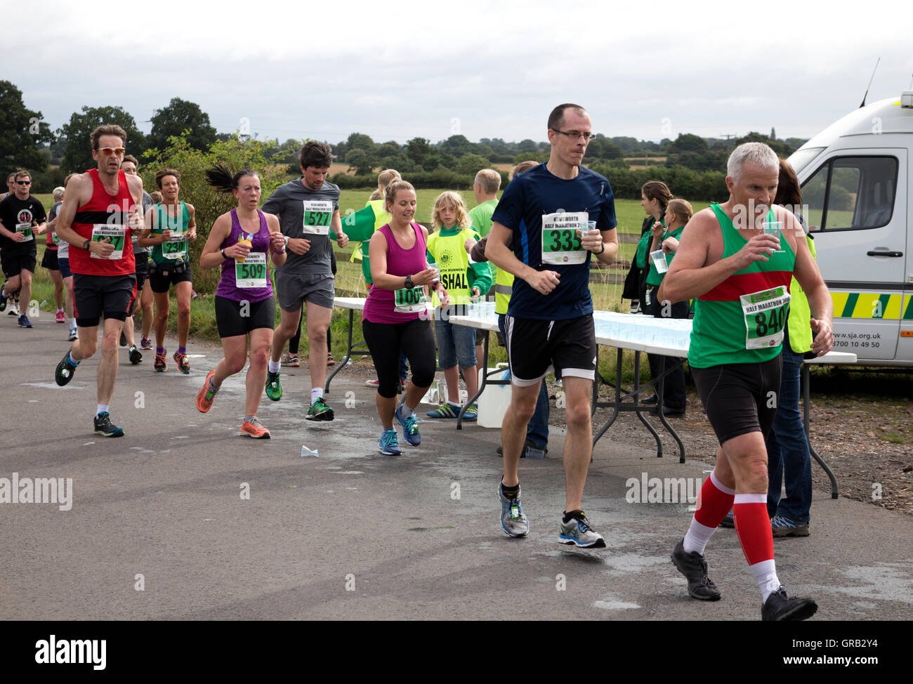 A drinks station at the Kenilworth Half Marathon race, Warwickshire, UK Stock Photo Alamy A drinks station at the Kenilworth Half Marathon race, Warwickshire, UK Stock Photo Alamy