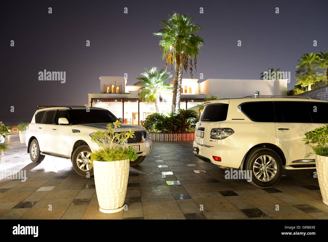 The luxury off-road cars are near luxurious hotel, Ras Al Khaima, UAE Stock Photo