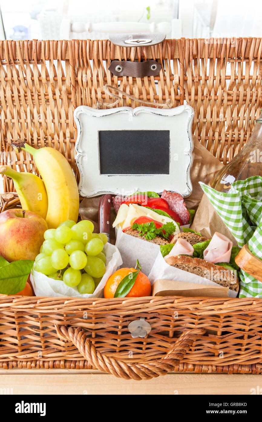 Picnic Basket With Sandwiches And Fruits Stock Photo - Alamy