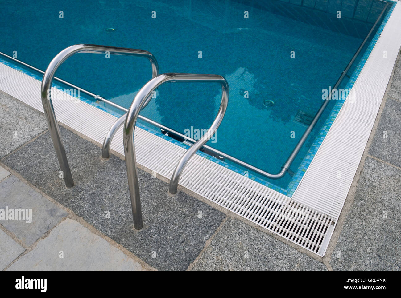 Swimming Pool And Ladder Railings Stock Photo - Alamy
