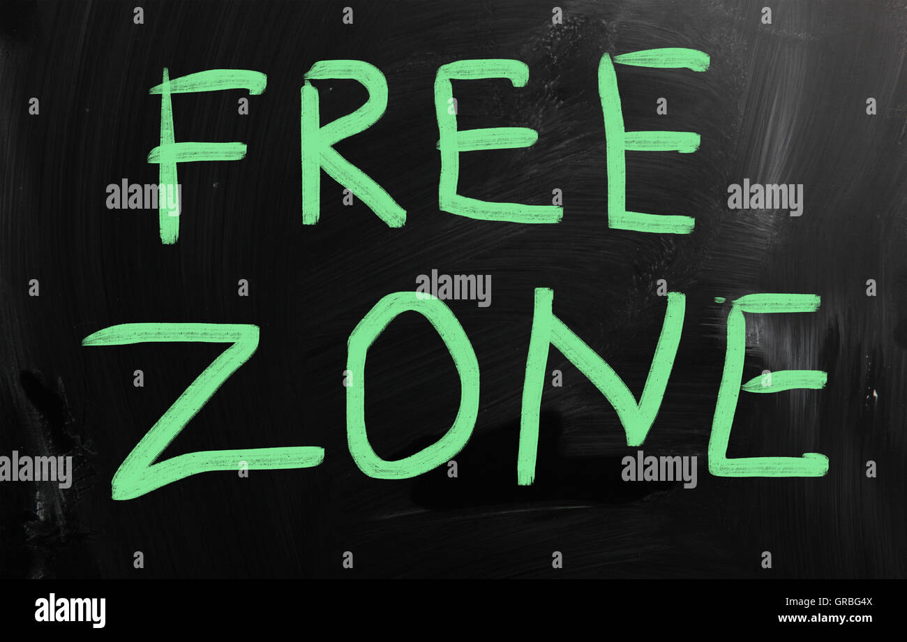 Free zone handwritten with white chalk on a blackboard Stock Photo