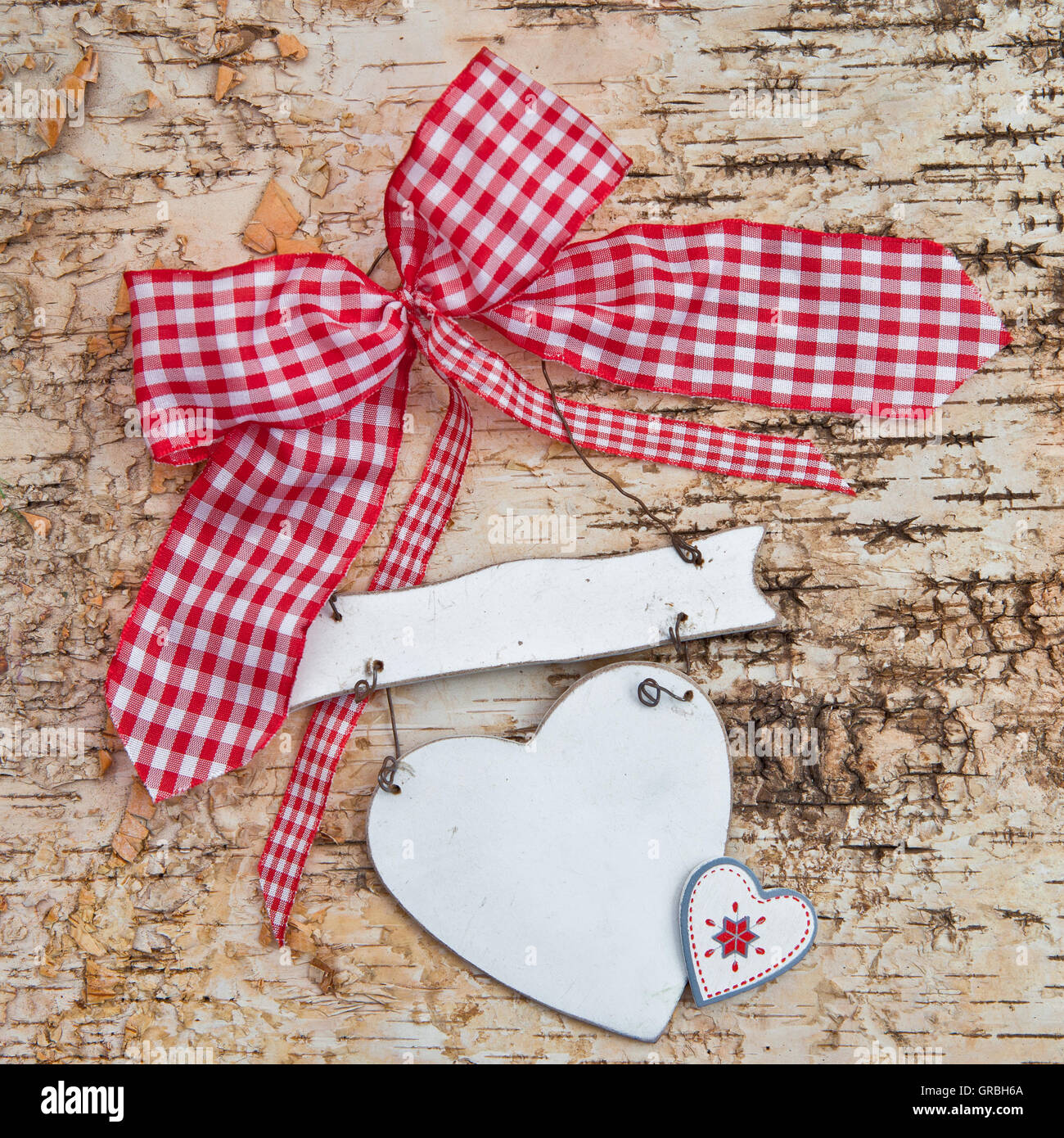 Blank heart on wooden background with red ribbon Stock Photo