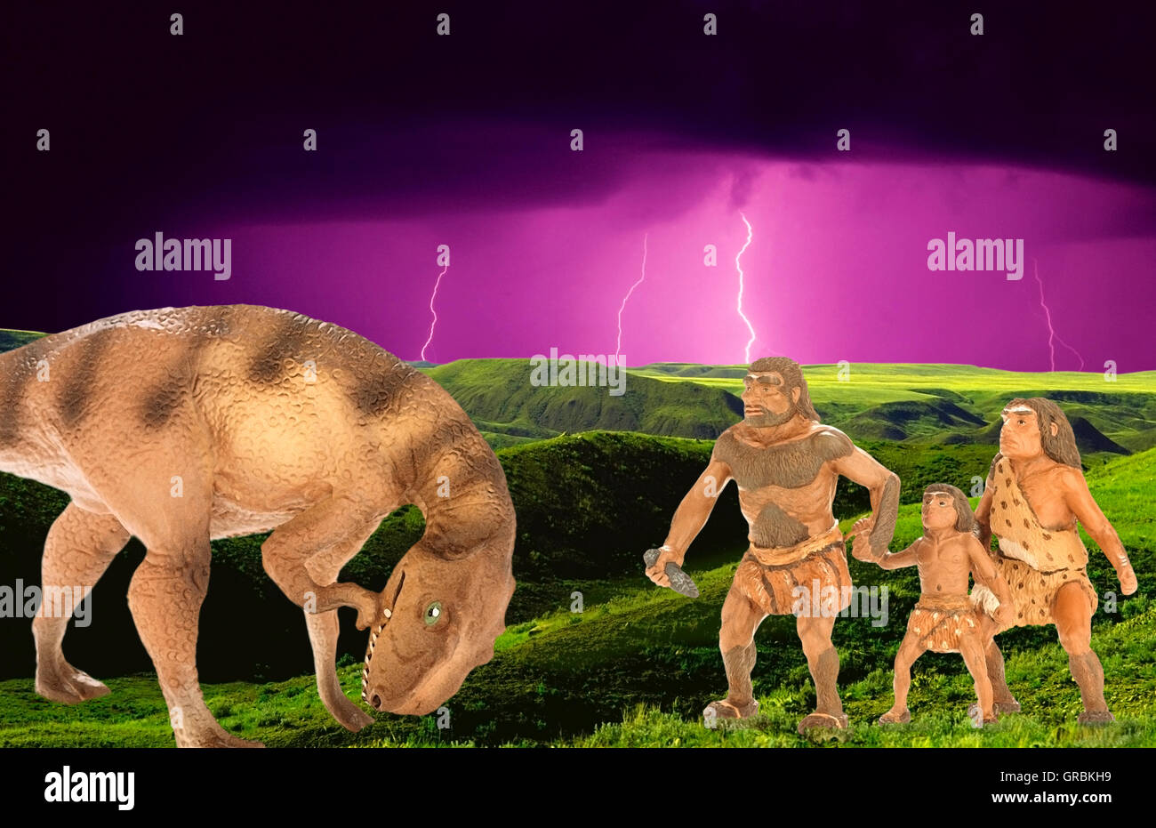 caveman defending family from dinosaura Stock Photo