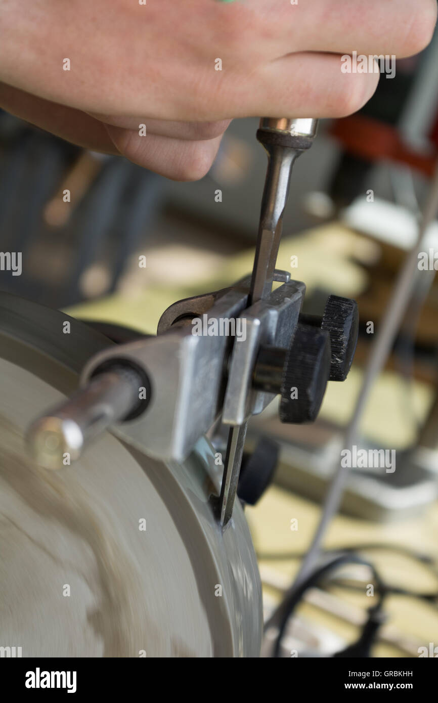 Sharpen With Wet Grinder Chisels Stock Photo Alamy