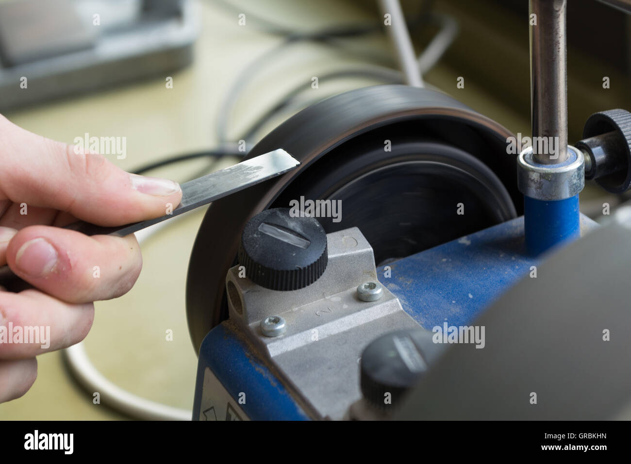 Sharpen With Wet Grinder Chisels Stock Photo Alamy