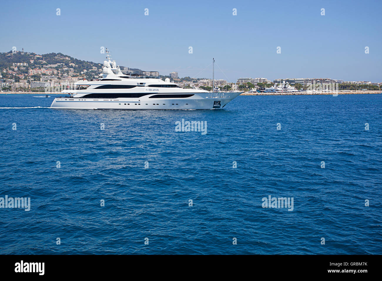 Luxury boat leaving Port de Cannes, France Stock Photo